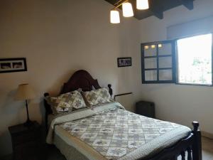 Uma cama ou camas num quarto em Casa de Campo Vaqueros Salta