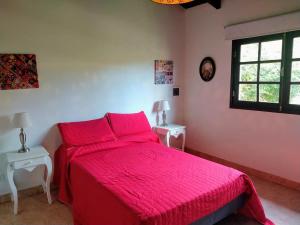 Ένα ή περισσότερα κρεβάτια σε δωμάτιο στο Casa de Campo Vaqueros Salta