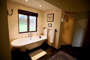 A bathroom at Ivory Wilderness River Rock Lodge