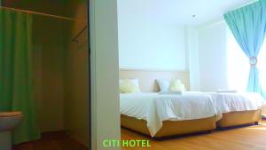 Citi Hotel客房内的一张或多张床位