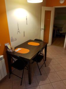 a wooden table with four chairs in a room at КВАРТИРА ЦЕЛИКОМ 3-rooms apartment in Tallinn