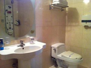 a bathroom with a sink and a toilet at Bali Tourist Hotel in Seoul