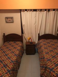 Posteľ alebo postele v izbe v ubytovaní Villa Gesell zona norte pinar cerca playa