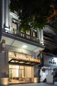 a hotel sign on the side of a building at Minasi HanoiOi Hotel in Hanoi