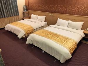 Кровать или кровати в номере 夏威夷酒店Melody Hawaii Hotel