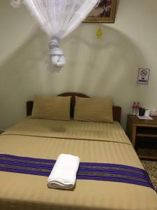 Manel Guesthouse and Restaurant客房内的一张或多张床位