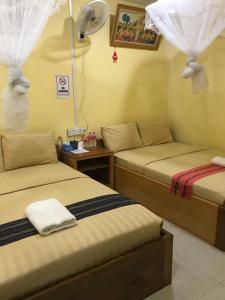 Manel Guesthouse and Restaurant客房内的一张或多张床位