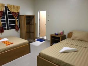 Manel Guesthouse and Restaurant客房内的一张或多张床位