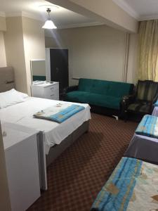 Postel nebo postele na pokoji v ubytování Paris Hotel