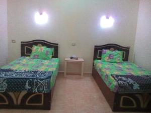 Un ou plusieurs lits dans un hébergement de l'établissement Abo ORabi Guest House