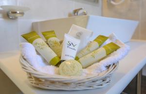 a basket of soap and candles on a table at Sea View Resorts & Spa in Karfas