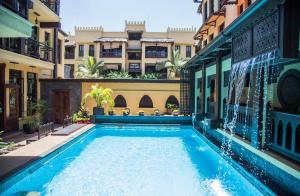 a swimming pool in the middle of a building at The King Post in Nairobi