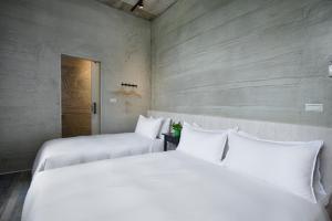 Letto o letti in una camera di Donggang Jingdi B&B