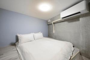 Letto o letti in una camera di Donggang Jingdi B&B