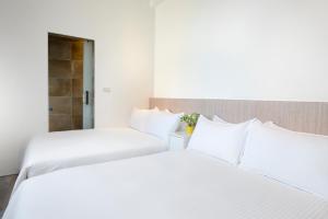 Letto o letti in una camera di Donggang Jingdi B&B