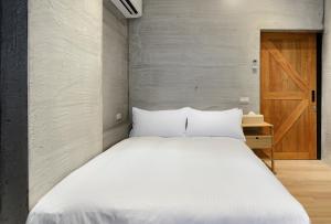 Letto o letti in una camera di Donggang Jingdi B&B