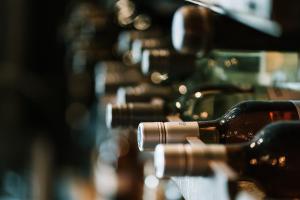 a row of wine bottles lined up in a row at Casa Alice in Rovinj