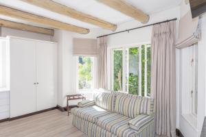 a living room with a couch and a window at 4 Piet Retief in Stellenbosch