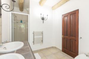 a bathroom with a sink and a toilet and a mirror at 4 Piet Retief in Stellenbosch +90 photos