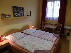Ein Bett oder Betten in einem Zimmer der Unterkunft Penzion Janovice
