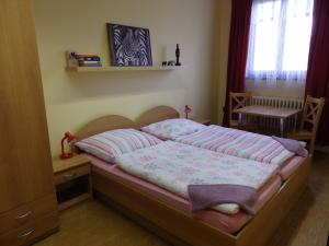 Ein Bett oder Betten in einem Zimmer der Unterkunft Penzion Janovice