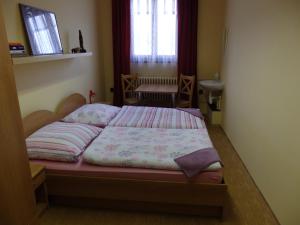 Ein Bett oder Betten in einem Zimmer der Unterkunft Penzion Janovice