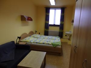 Ein Bett oder Betten in einem Zimmer der Unterkunft Penzion Janovice