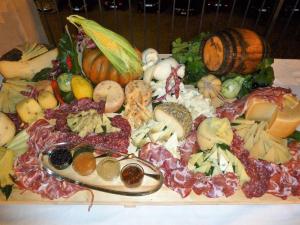 a bunch of different types of food on a cutting board at Silva Suri in Marina di Ragusa