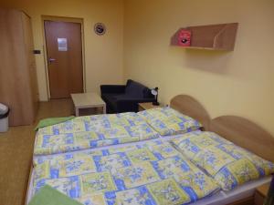 Ein Bett oder Betten in einem Zimmer der Unterkunft Penzion Janovice