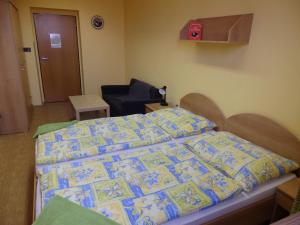 Ein Bett oder Betten in einem Zimmer der Unterkunft Penzion Janovice