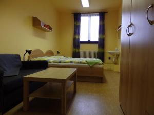 Ein Bett oder Betten in einem Zimmer der Unterkunft Penzion Janovice