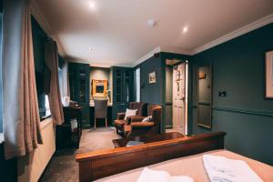 a bedroom with a bed and a living room at Weavers Guesthouse by Weavers of Haworth in Haworth