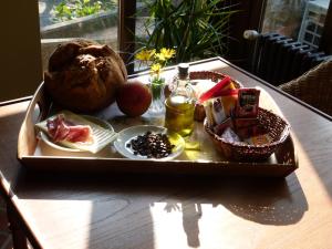 a tray of food on top of a table at Hotel Finca Los Venancios in Bones
