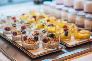 a buffet of desserts and snacks in glass jars at Iberostar Selection Marbella Coral Beach in Marbella