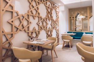 a dining room with a table and chairs at Iberostar Selection Marbella Coral Beach in Marbella