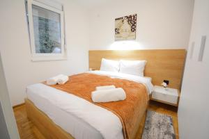 Cama o camas de una habitación en Cvetkovic LUX Аpartmani & Free GARAŽA