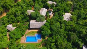 an aerial view of a house in the middle of a forest at Cloud Nine Lanka Resort Wilpattu in Wilpattu