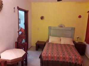 Katil atau katil-katil dalam bilik di Cancun Guest House 3 near Ado bus terminal and 25 min from-to airport by shuttle