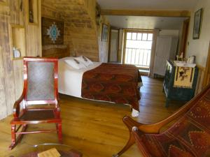 Posezení v ubytování chambre d'hôte atypique "West little ranch" chambre amérindienne
