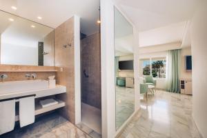 a bathroom with a sink and a shower at Iberostar Selection Marbella Coral Beach in Marbella