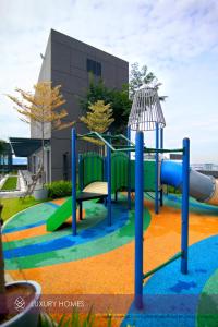 a playground in front of a building at Vale Pine Dorsett Residences Bukit Bintang in Kuala Lumpur
