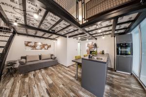 a kitchen and living room with a couch and a table at Sofia Parter Life Apartment in Sofia