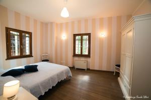 Giường trong phòng chung tại Residenza Fondo Ulivi