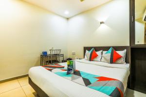 a bedroom with two beds in a room at FabExpress Adore Inn in Mumbai