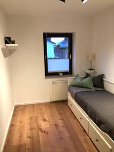 a bedroom with a bed and a tv on the wall at Ferienwohnung direkt am Skigebiet und Bikepark in Winterberg