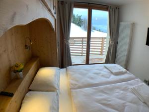 Un pat sau paturi într-o cameră la ILIA House