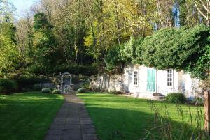 a garden with a pathway leading to a house at Kingswood Hotel in Burntisland