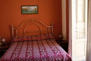 A bed or beds in a room at I Cavalieri di Malta