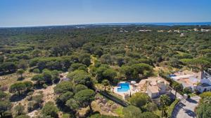 an aerial view of a house with a swimming pool at Villa Tulum by Algarve Vacation in Almancil