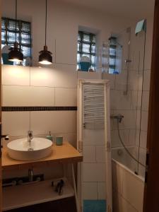 a bathroom with a sink and a shower at Kosiedlisko in Kraśnik +64 photos